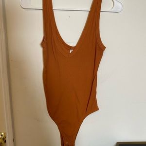 BP rust colored body suit